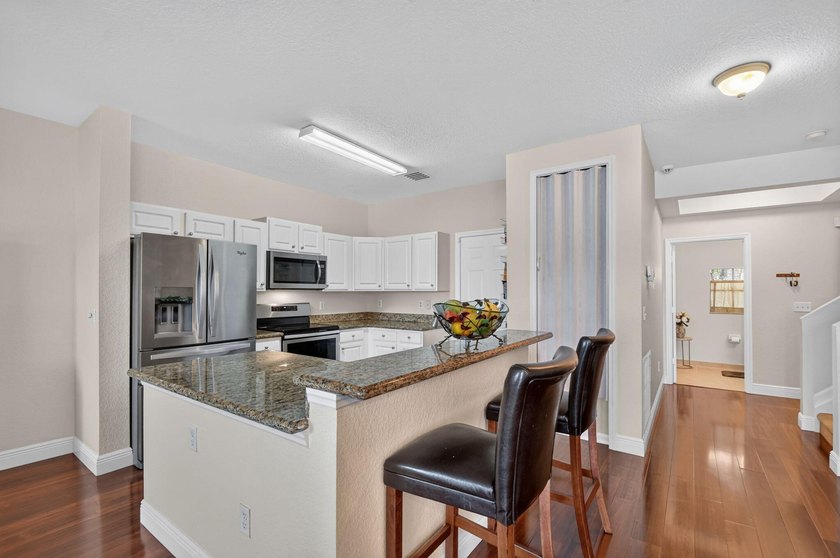 Welcome to this WATERFRONT END UNIT TOWNHOME in Emerald Lakes of - photo 14