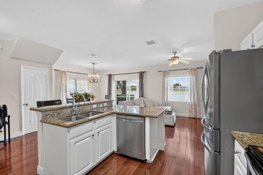 Welcome to this WATERFRONT END UNIT TOWNHOME in Emerald Lakes of - photo 17