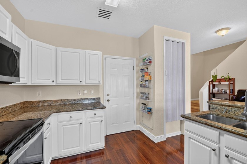 Welcome to this WATERFRONT END UNIT TOWNHOME in Emerald Lakes of - photo 18