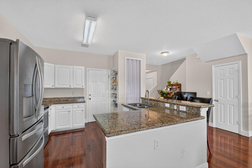 Welcome to this WATERFRONT END UNIT TOWNHOME in Emerald Lakes of - photo 19