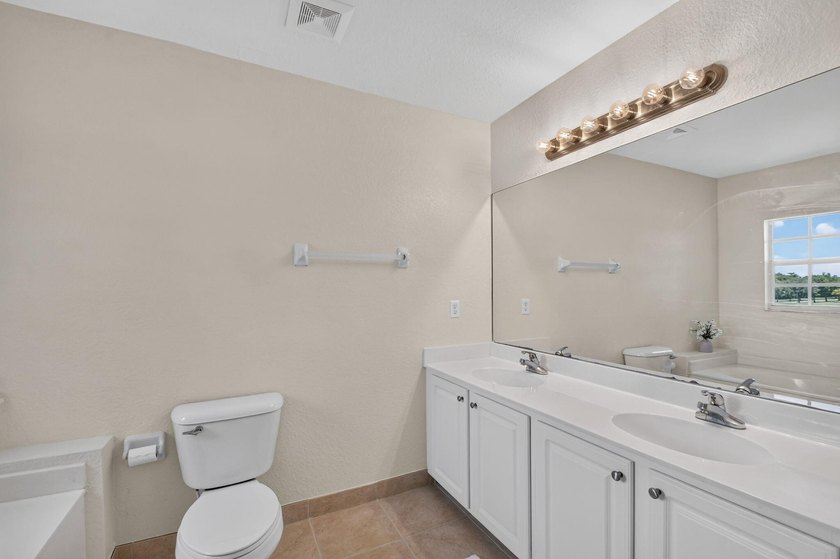 Welcome to this WATERFRONT END UNIT TOWNHOME in Emerald Lakes of - photo 33
