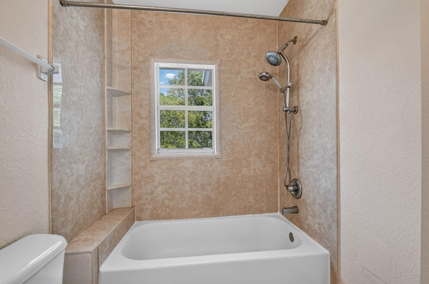 Welcome to this WATERFRONT END UNIT TOWNHOME in Emerald Lakes of - photo 49