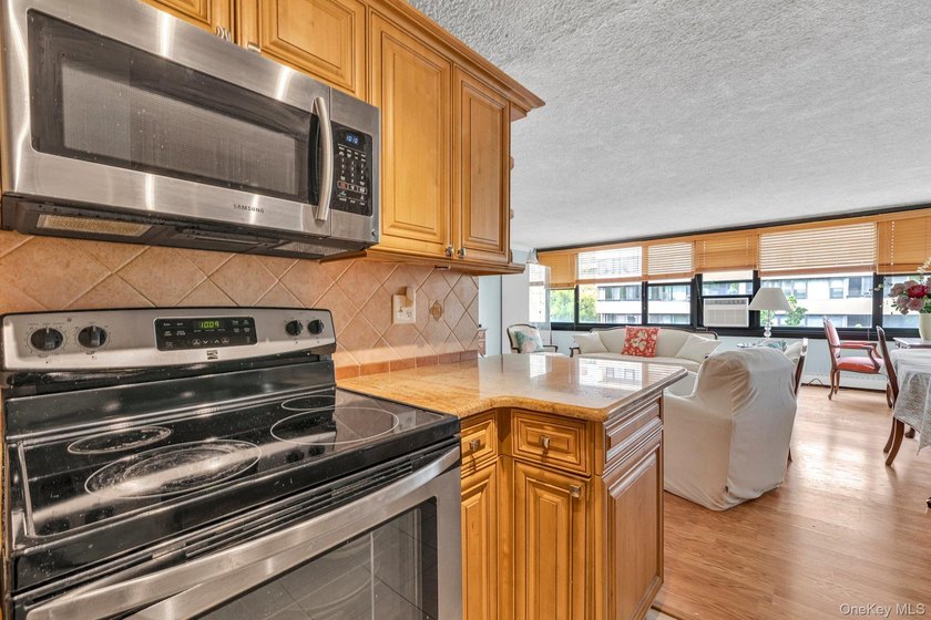 Bright and airy open concept layout with stunning wall of - photo 5