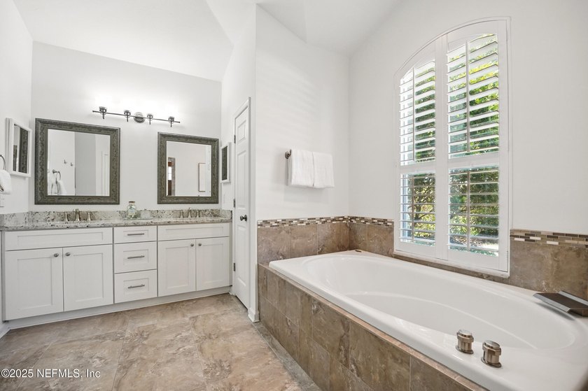 Nestled on a private 1.67-acre estate across from the - photo 29