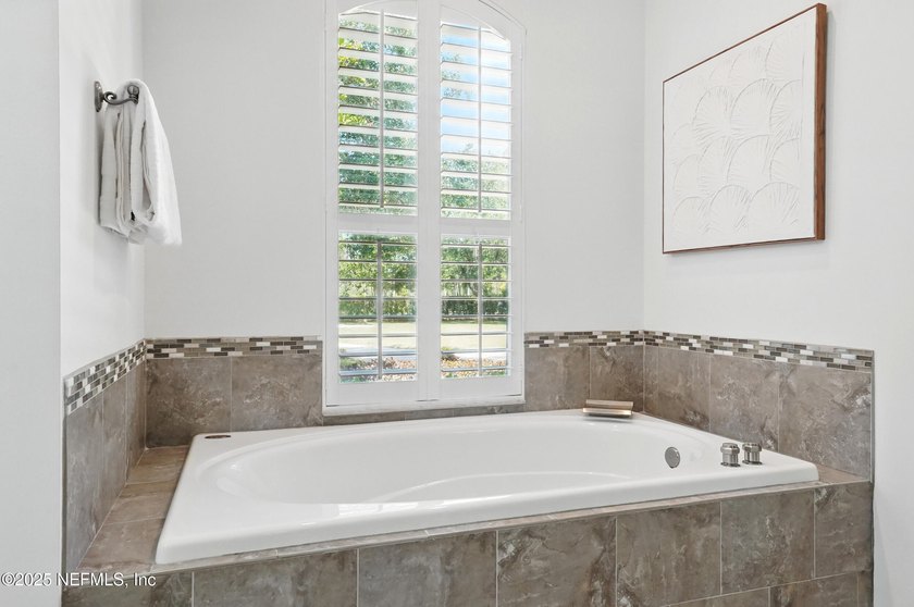 Nestled on a private 1.67-acre estate across from the - photo 31