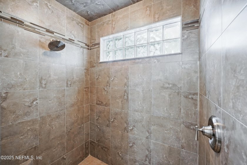 Nestled on a private 1.67-acre estate across from the - photo 32