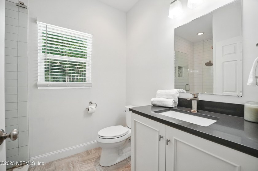 Nestled on a private 1.67-acre estate across from the - photo 35