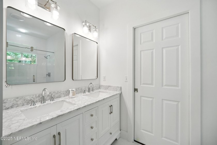 Nestled on a private 1.67-acre estate across from the - photo 39