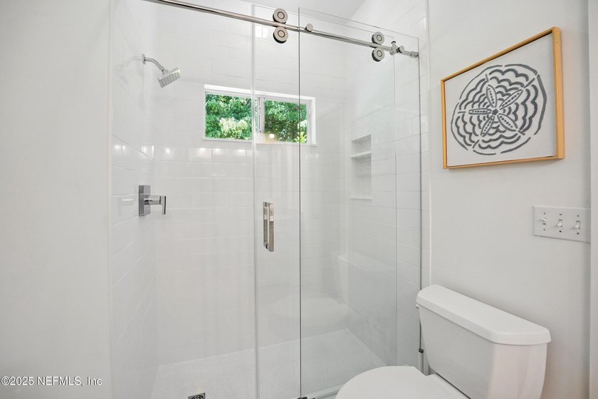 Nestled on a private 1.67-acre estate across from the - photo 41