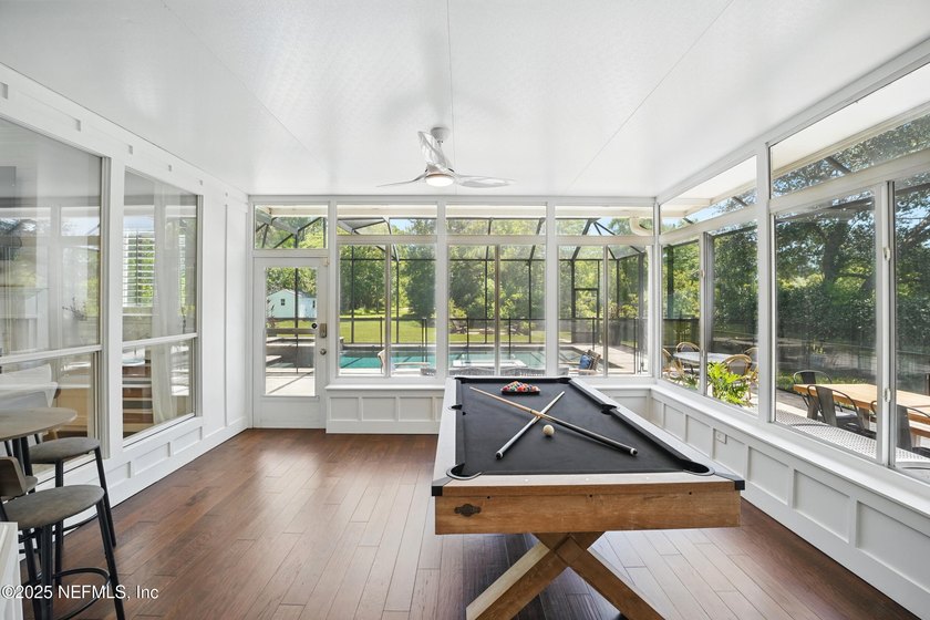 Nestled on a private 1.67-acre estate across from the - photo 48