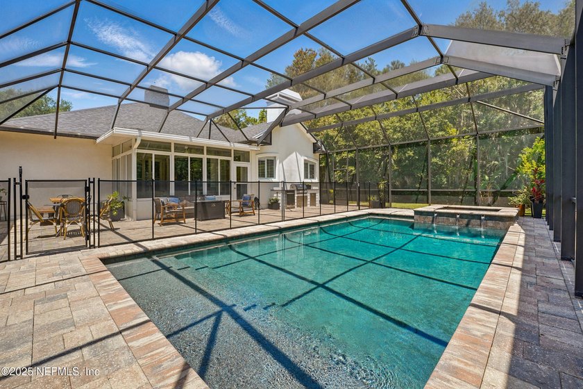 Nestled on a private 1.67-acre estate across from the - photo 52
