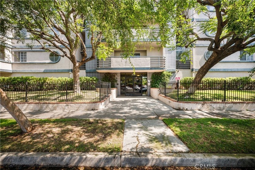 Welcome to Unit 311 at Pars Plaza, a beautifully maintained - photo 42