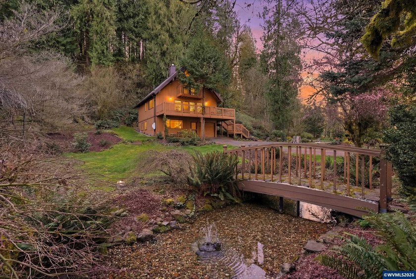 A custom chalet-style home surrounded by natural forest on - photo 44