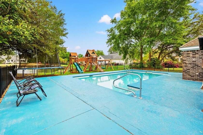 Custom built all-brick home, with a large private pool, on a - photo 33