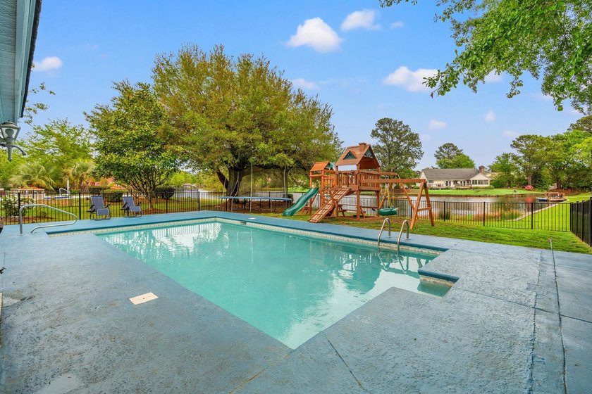 Custom built all-brick home, with a large private pool, on a - photo 35