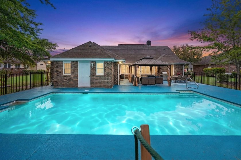 Custom built all-brick home, with a large private pool, on a - photo 36