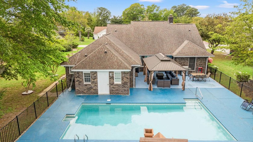 Custom built all-brick home, with a large private pool, on a - photo 39
