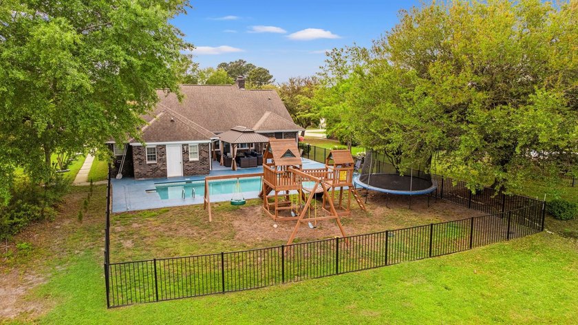 Custom built all-brick home, with a large private pool, on a - photo 40