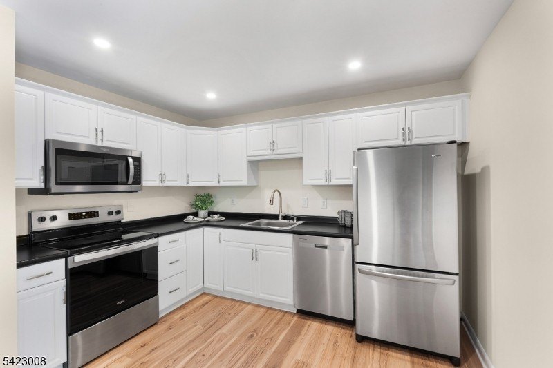 Welcome to this newly renovated bilevel, positioned perfectly on - photo 16