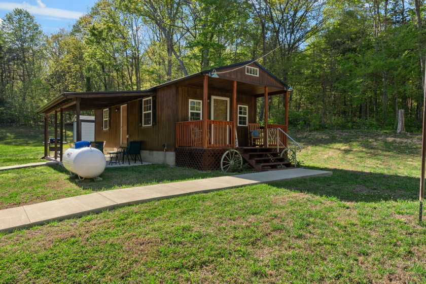 Unrestricted, Lakefront Tiny Home on 5.74 acres! - photo 2