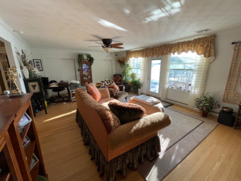 Main living room. Door leading to upper deck. - photo 9