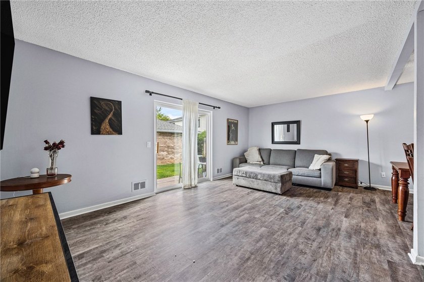 Brighton welcomes you home to this beautifully updated end-unit - photo 9