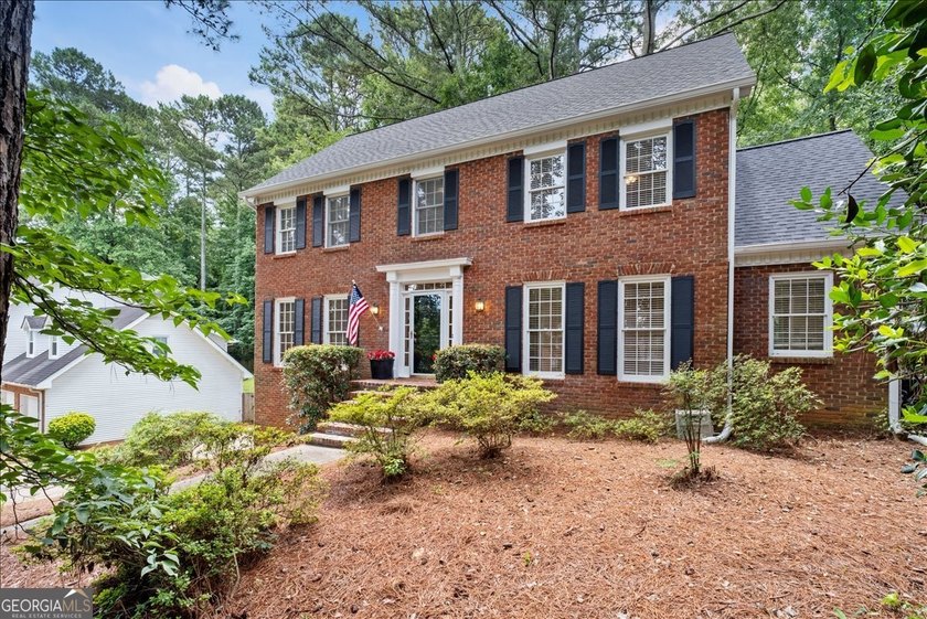Traditional brick home on a lovely wooded lot near the best of - photo 7