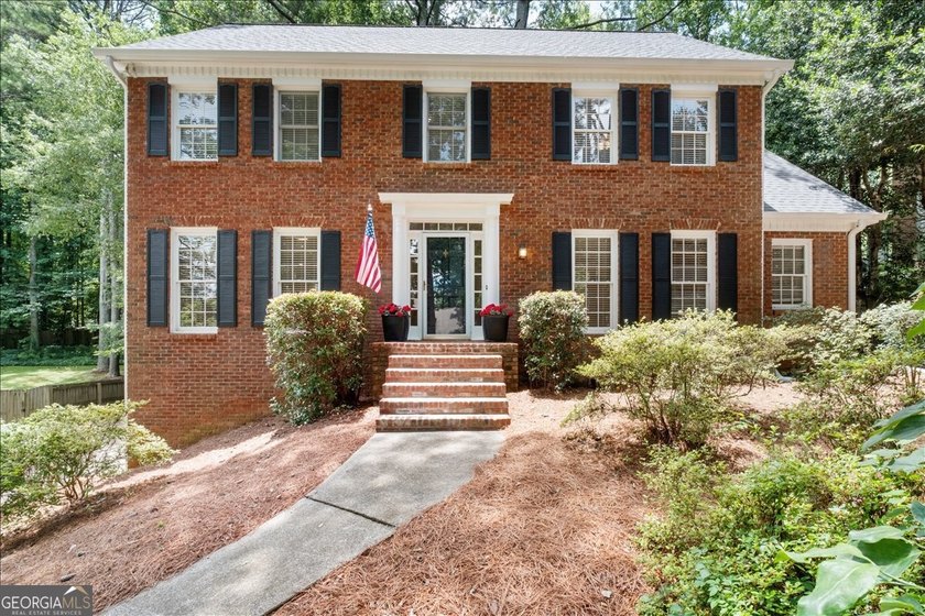Traditional brick home on a lovely wooded lot near the best of - photo 8