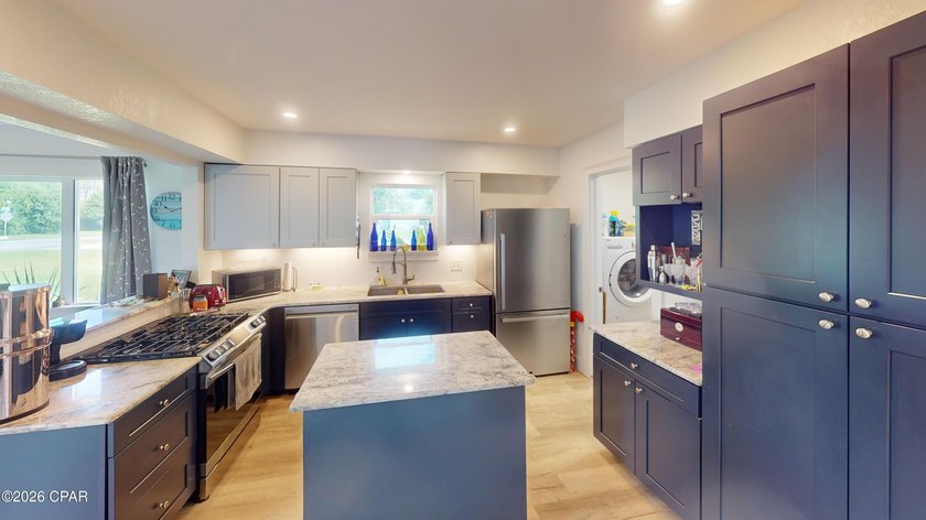 Welcome to 2001 Palm Boulevard, where coastal convenience meets - photo 10