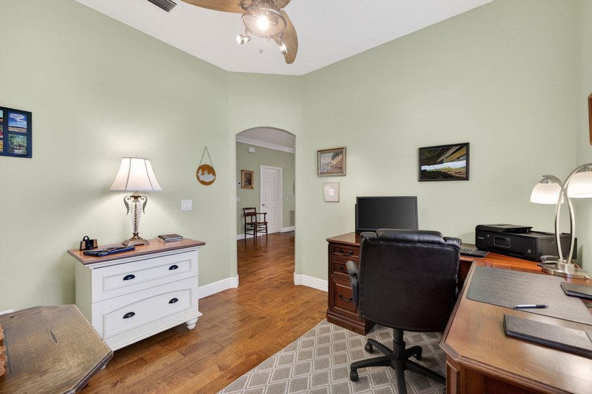 Situated on a large corner lot with lush tropical landscaping - photo 17