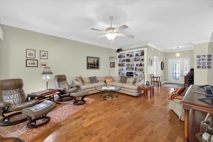 Situated on a large corner lot with lush tropical landscaping - photo 20