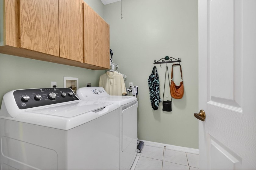 Situated on a large corner lot with lush tropical landscaping - photo 32