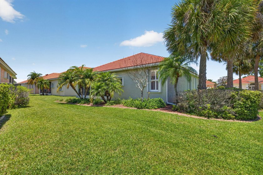 Situated on a large corner lot with lush tropical landscaping - photo 37