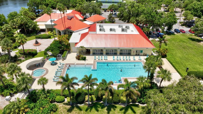 Situated on a large corner lot with lush tropical landscaping - photo 39