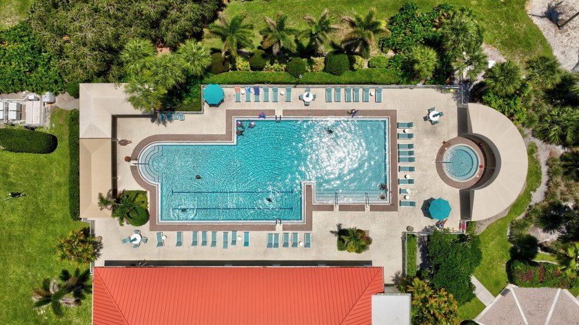 Situated on a large corner lot with lush tropical landscaping - photo 42