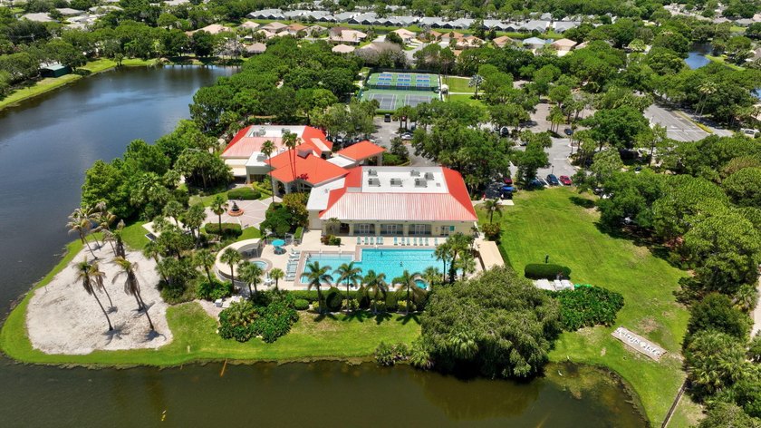 Situated on a large corner lot with lush tropical landscaping - photo 43