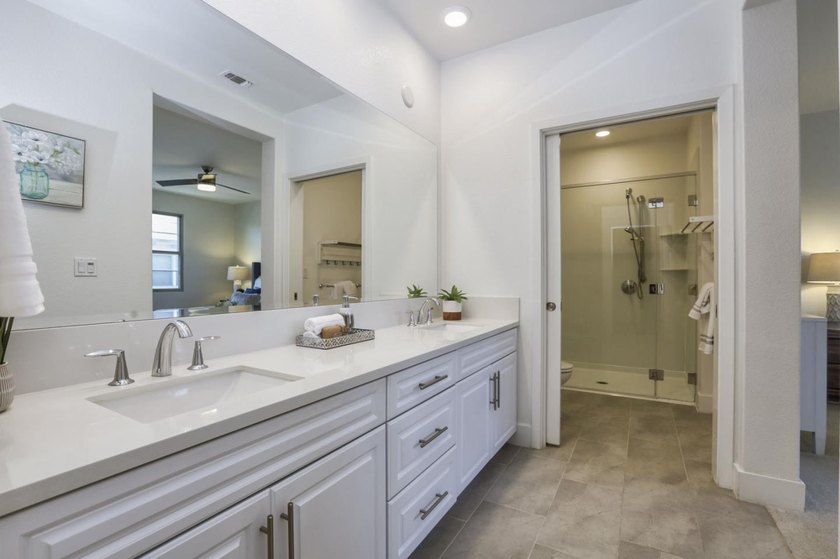 Welcome to 1089 Dewberry Place #401, a stunning top-floor corner - photo 28