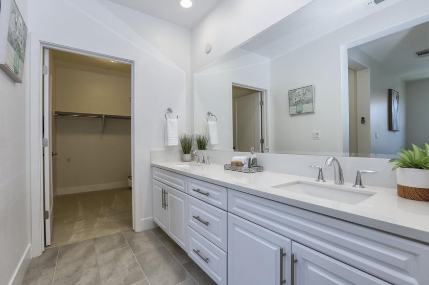 Welcome to 1089 Dewberry Place #401, a stunning top-floor corner - photo 29