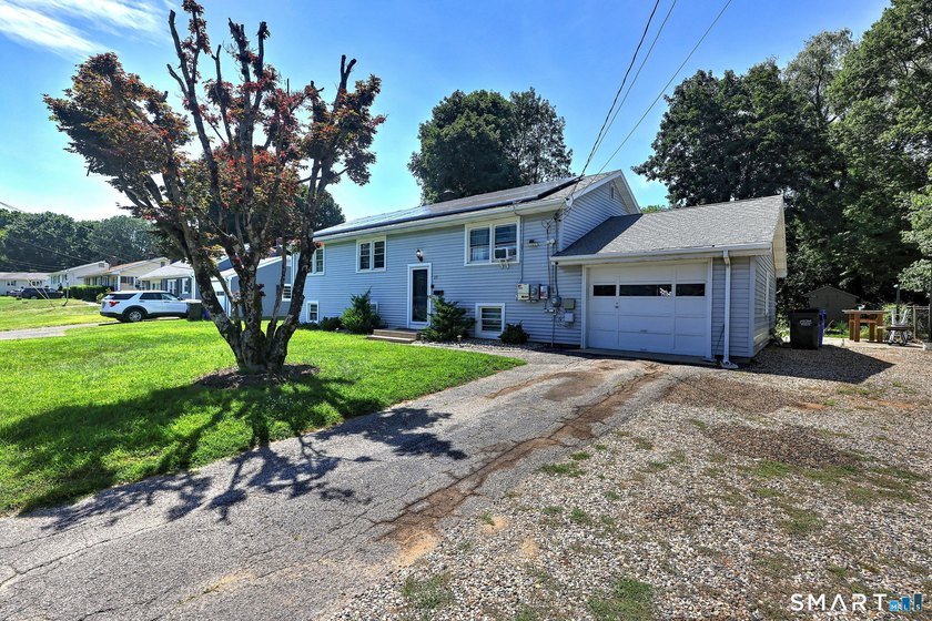 Welcome to this beautiful raised ranch located on a quiet street - photo 2