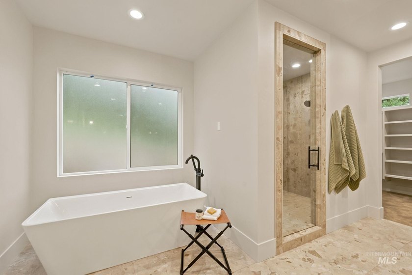 Nestled on a private, majestic wooded lot, this exquisite - photo 9