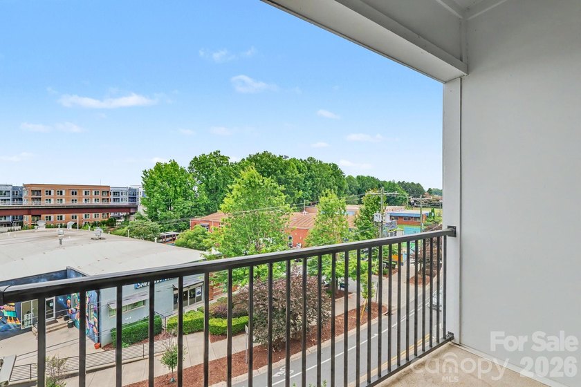 Perched on the top floor of one of NoDa's most coveted addresses - photo 10