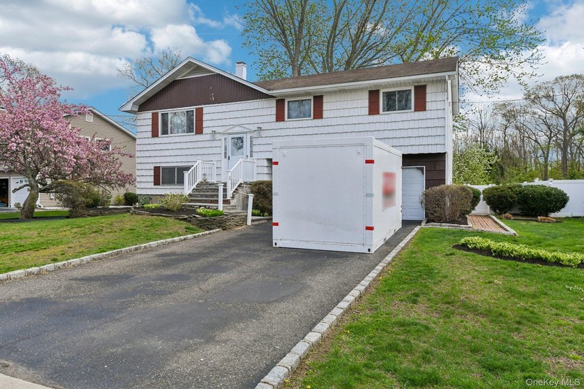 Welcome to this spacious 4-bedroom, 1.5-bath high ranch nestled - photo 3