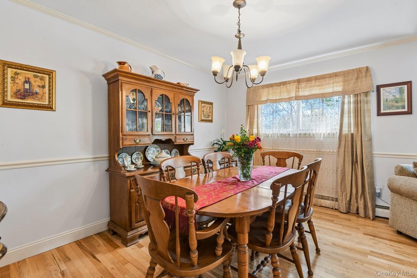 Welcome to this spacious 4-bedroom, 1.5-bath high ranch nestled - photo 8