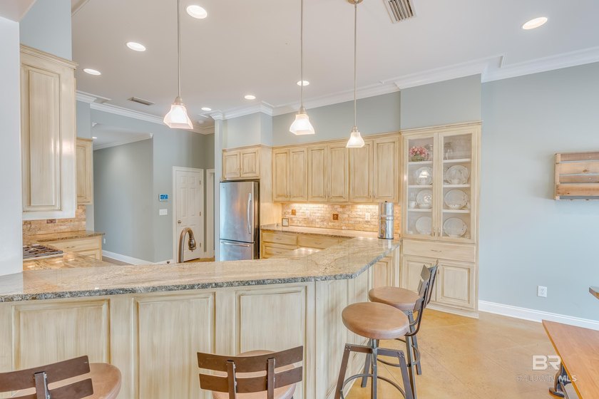 Located in the Rock Creek Golf Course community, this 4-bedroom - photo 3