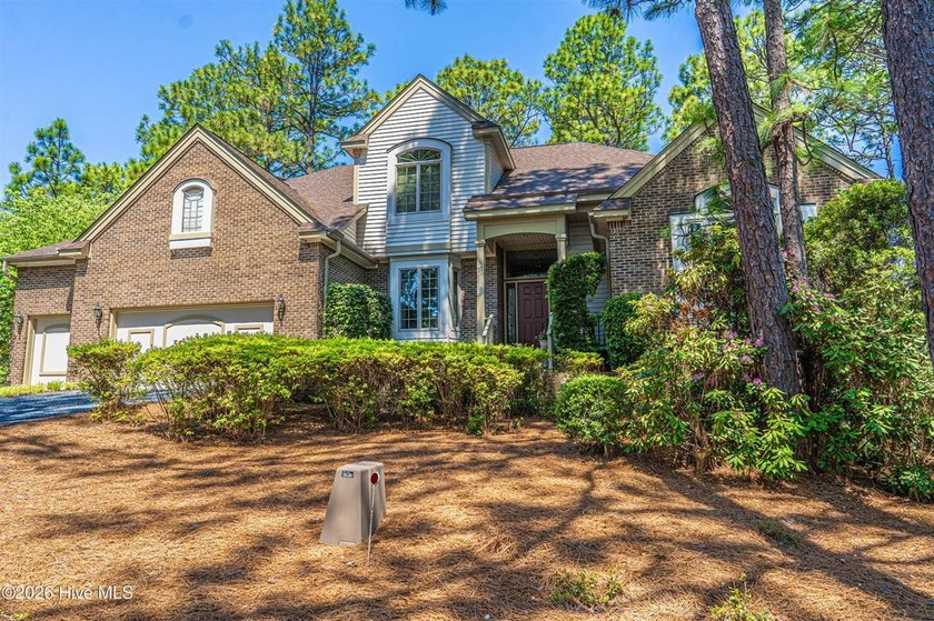 Located in the Pinehurst No. 6 neighborhood, this custom-built - photo 2