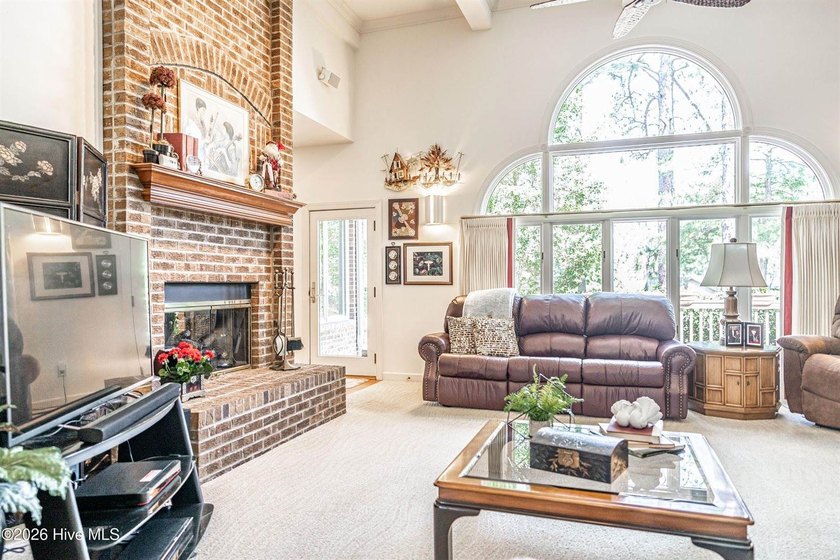 Located in the Pinehurst No. 6 neighborhood, this custom-built - photo 4