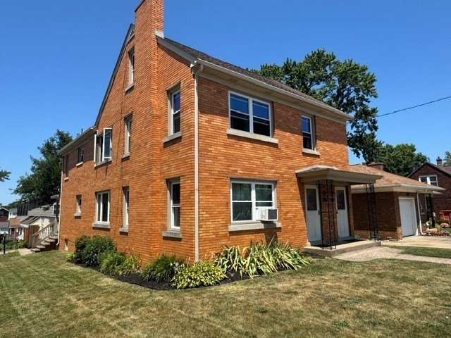 Beautiful brick two unit near the VA that has a two-car detached - photo 2