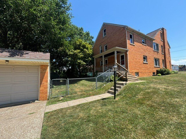 Beautiful brick two unit near the VA that has a two-car detached - photo 3