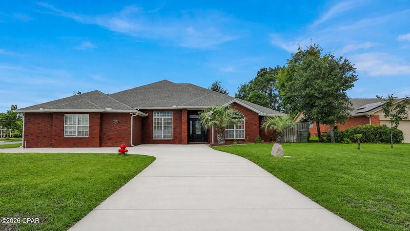 This CUSTOM all brick one level 4 bedroom 3.5 bath home with - photo 3