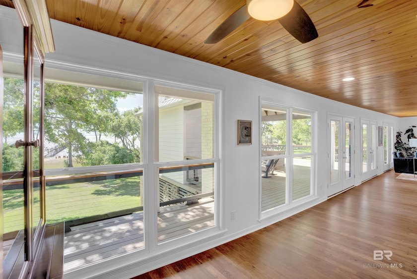 This exquisite bayfront residence features 1.22 acres along the - photo 11
